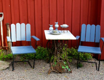 A cheap and inexpensive patio solution with refinished chairs and a repurposed antique table