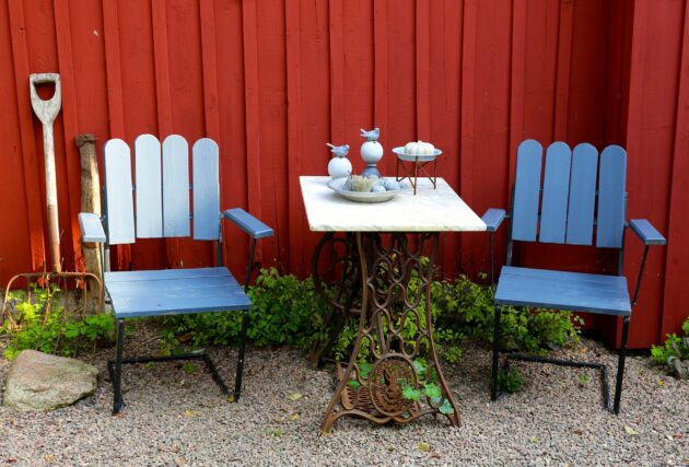A cheap and inexpensive patio solution with refinished chairs and a repurposed antique table