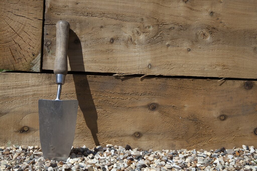 Use a trowel to carefully dig up the soil sample.
